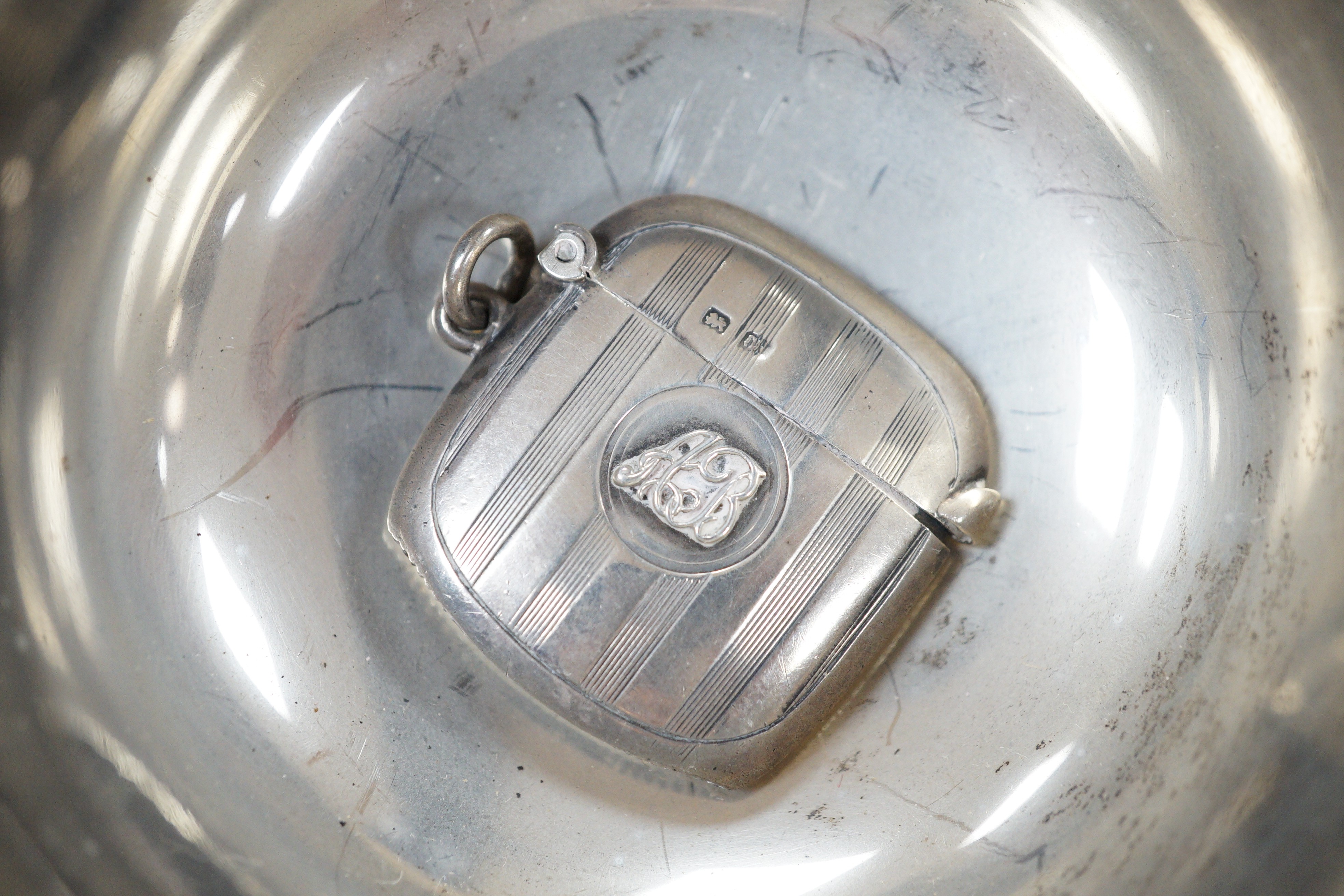 Small silver including a George V quaich, Edinburgh, 1928, a pair of condiments, circular box and cover, mug, toilet jar and three items of cutlery.